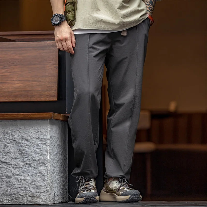 Pantalones funcionales casuales al aire libre para hombres, pantalones cónicos rectos versátiles con cintura elástica 